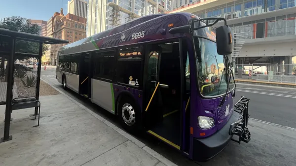 Black and purple hybrid Phoenix Public Transit bus.